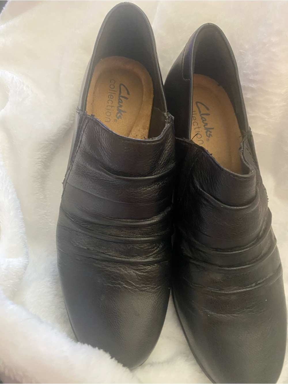 Clarks Emily Cove Black Leather Slip-On Ankle Boots with Ruched Detailing